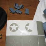 I utilized the scraps from around the star for painting the horizontal bar, as they're the same radius as the roundel.