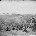 Belle Plaine camp in background, Confederate prisoners in foreground.